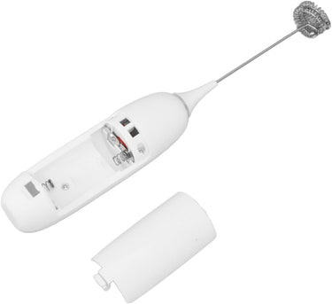 The Handheld Frother – Whip It Real Good ☕⚡ is shown with its battery compartment open, cover removed to reveal metal spring connectors inside, and features a long whisk attachment at one end.